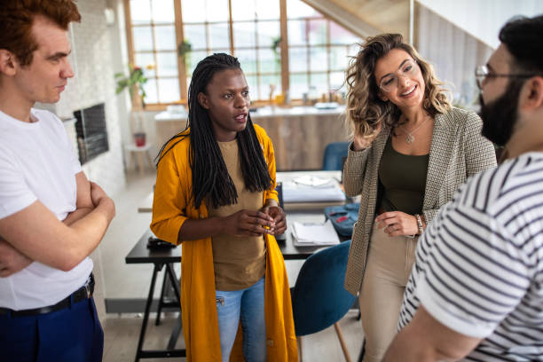 istock Multi-ethnic group of colleagues having fun at office 1252702583