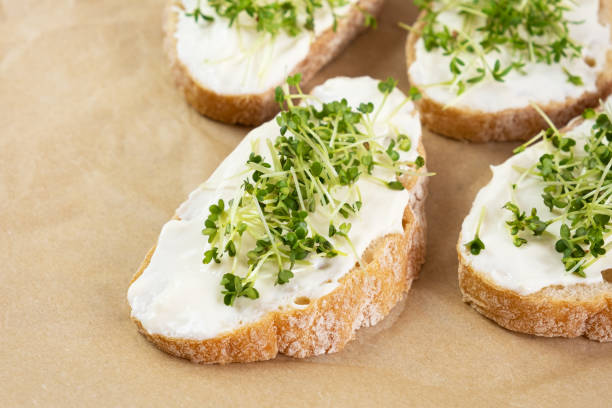 istock Healthy breakfast. Sandwich with cream cheese and microgreens. 1252702835