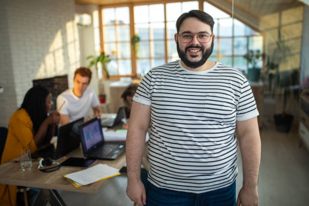 istock Confident overweight businessman at office 1252702857