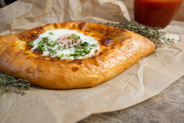 istock Khachapuri with the egg and herbs. Georgian cuisine. 1252702877