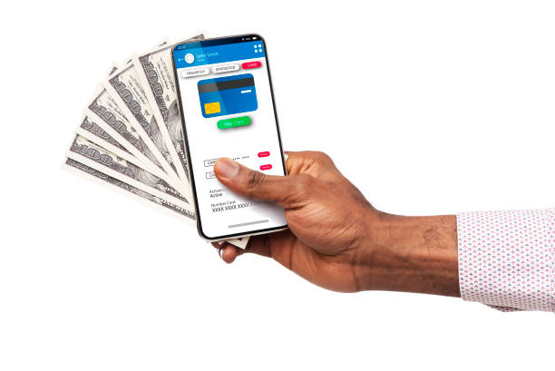 Mobile Banking. Black Male's Hand Holding Smartphone With Card Information And Cash Mobile Banking. Black Male's Hand Holding Smartphone With Credit Card Holder Information And Dollar Cash, Closeup digital wallet photos stock pictures, royalty-free photos & images
