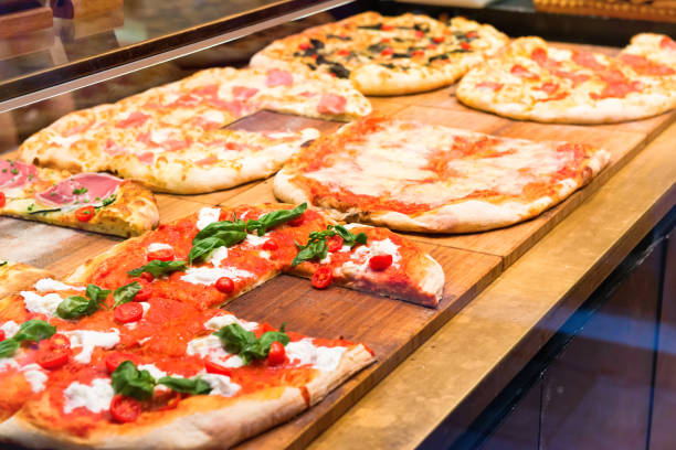 istock Many slices of pizza on wooden table 1252703421