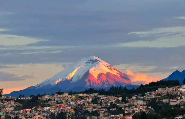 The last rays of sunlight illuminate the Cotopaxi Volcano