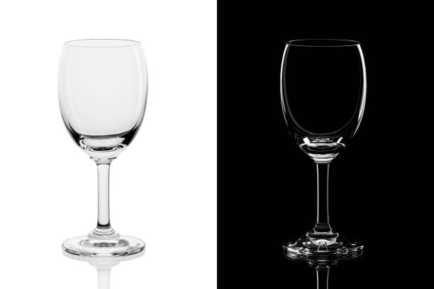 istock Empty wine glass isolated on black and white background 1252707217
