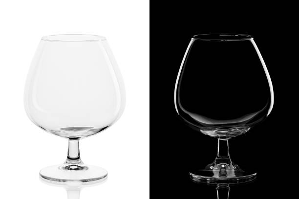 istock Empty cognac glass isolated on black and white background 1252707219