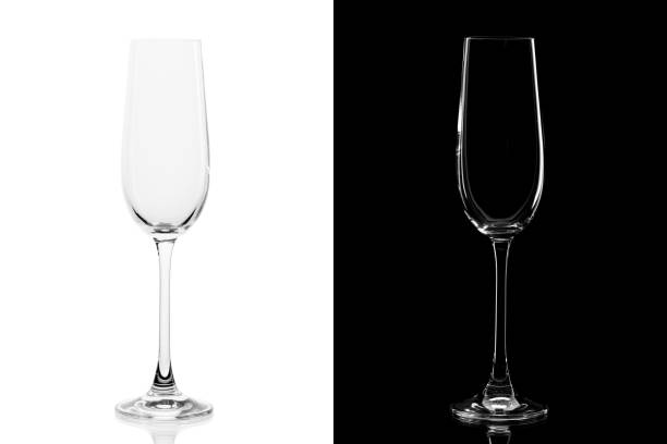 empty champagne glass isolated on white and black background - nobody alcohol champagne wine imagens e fotografias de stock