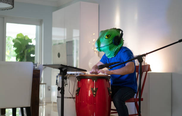 istock Goofing around during a video call wearing a lizard mask 1252707378
