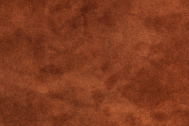 istock Old ginger leather texture background. closeup view of suede 1252707829