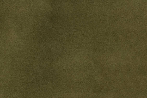 istock Olive green leather texture background. closeup view of suede 1252708155