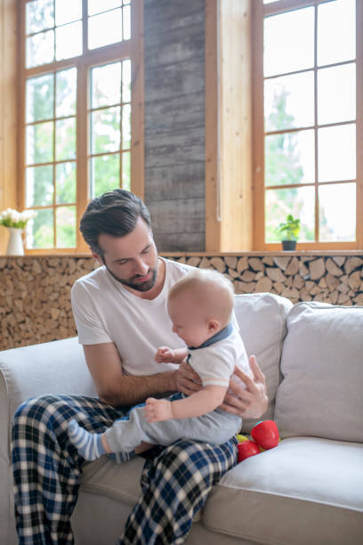 istock Young happy father holding his ltitle kid 1252708388