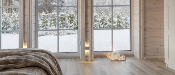 istock Bright photo studio interior with big window, high ceiling, white wooden floor 1252709027