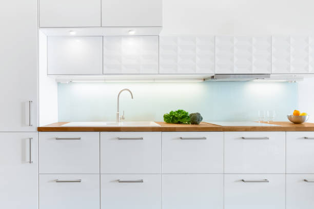 istock Modern white kitchen with wooden countertop 1252714074