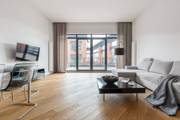 istock Spacious living room with wooden floor 1252714083