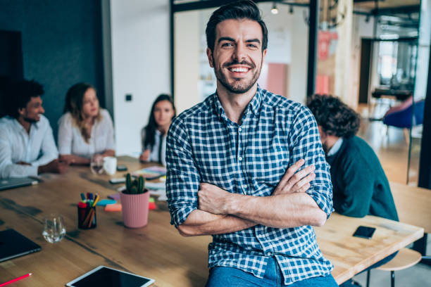 istock Confident businessman and his team. 1252716395