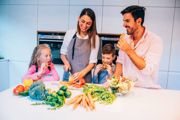 istock Happy family in the kitchen. 1252716442
