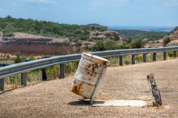 istock Rusty garbage can on a parking lot in Texas 1252717160