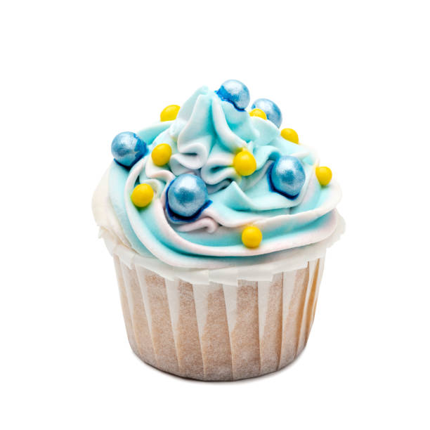 istock Blue cupcake decorated with candy balls on white background. isolated 1252718968