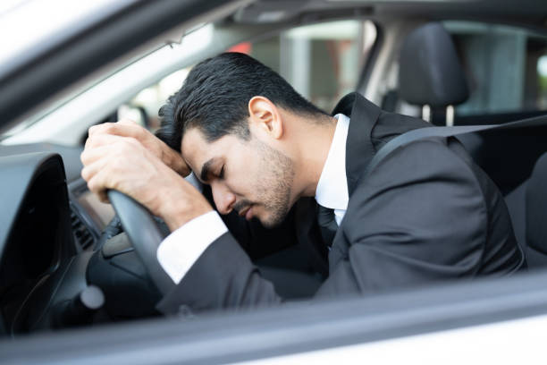 istock Young Businessman Sleeping In Car 1252719333