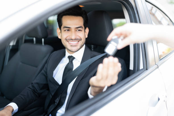 istock Smiling Young Businessman Buying Car 1252719381
