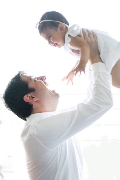 istock Loving daddy carrying very playfully his daughter both smiling 1252720325