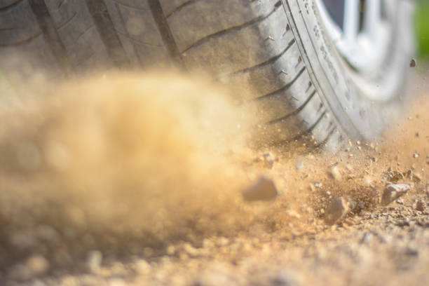 istock The car tire slips on a macadam surface - close-up photography 1252721937