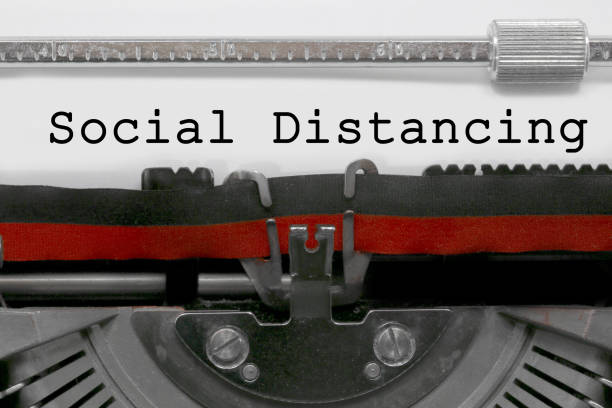 istock Social Distancing text on white sheet in vintage typewriter 1252721954