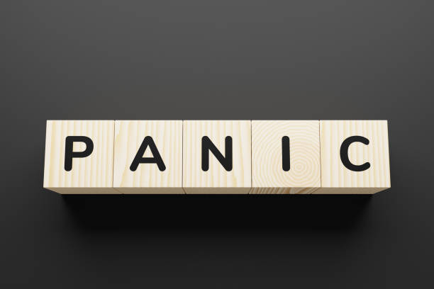 istock PANIC word on a wooden blocks. 1252722025