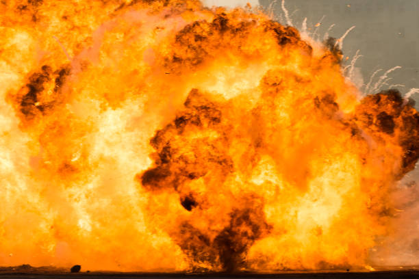 istock Massive orange fire explosion in military combat and war. Vehicle explosion from a tank in a city in the Middle East. Military Concept. Strength, power, explosion. 1252732772