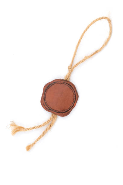 Empty old seal wax with the cord over white