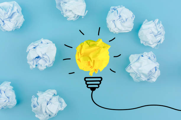 istock Inspiration concept crumpled paper light bulb metaphor for good idea 1252736557