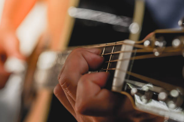 istock Men playing acoustic guitar, Close-up 1252736702