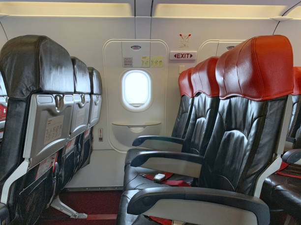 istock Emergency exit window in aircraft cabin. Long leg room seat. premium seat. Emergency exit seat. 1252738017