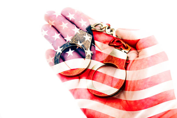 istock image of handcuff hand white background 1252738241