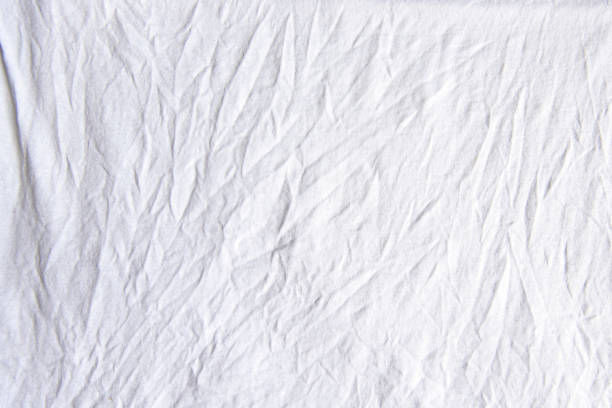 istock Wrinkled crumpled white cloth, background or texture 1252738616