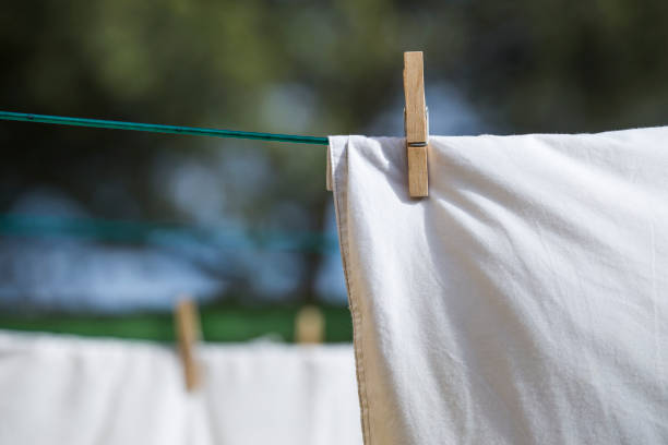 istock white garments hanging in the clothesline 1252750715