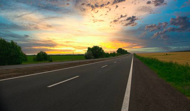 istock highway goes to the horizon between the fields of wheat 1252752696