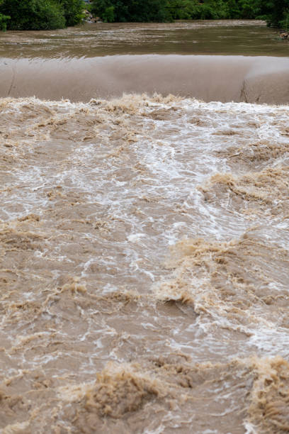 istock Flooding after storm - unglean water with soil comming 1252756230