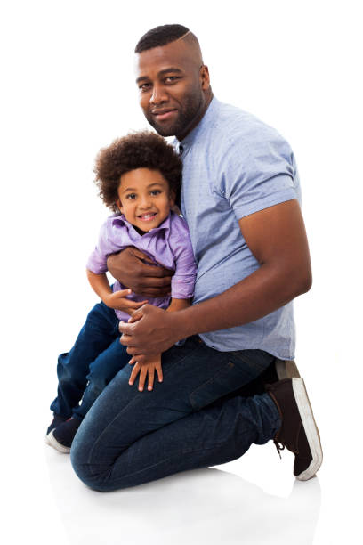 istock Proud african american father with his son smiling at camera 1252756579