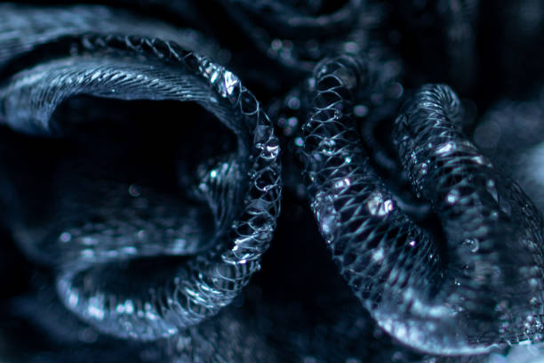 istock Twists of blue net with water drops crystals stuck background 1252758054