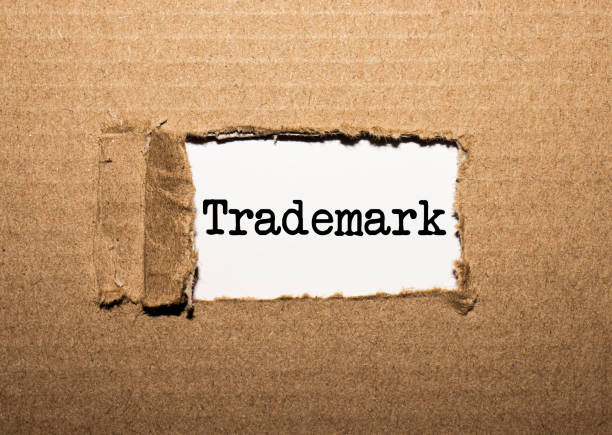 istock The text TRADEMARK. behind torn brown paper 1252758820