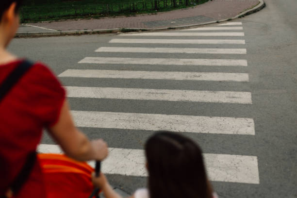 istock Mother with her children on crosswalk 1252758878