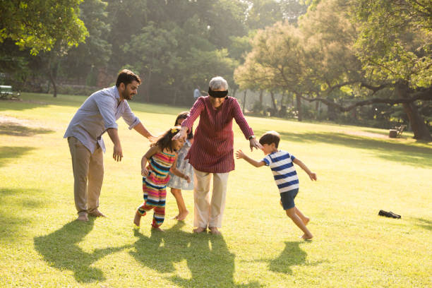 multi generation family - Stock images Indian ethnicity, lifestyle, grandfather, grandchild, child, indian man walking in park stock pictures, royalty-free photos & images