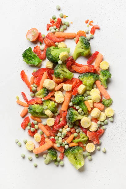 Frozen food colorful vegetables isolated on white background.