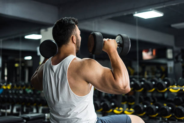 istock bodybuilder running shoulder muscle by sitting 1252763156