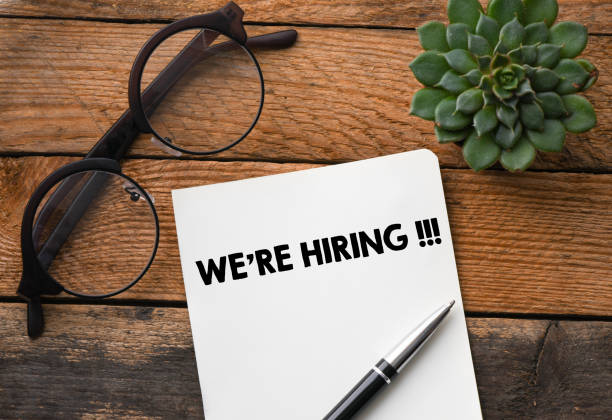 istock We're Hiring words written on notepad. Concept in business. 1252763474