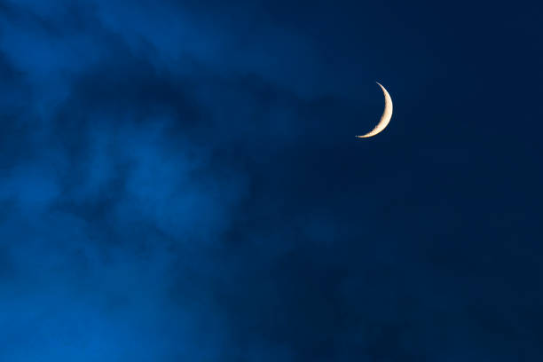 Blue foggy sky with crescent or half moon Blue foggy sky with crescent or half moon crescent photos stock pictures, royalty-free photos & images