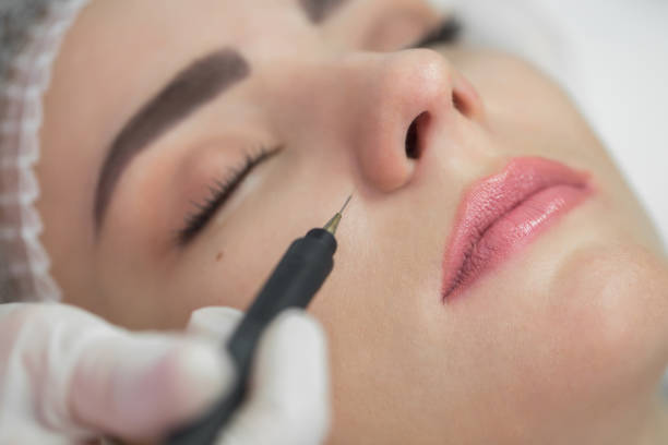 istock Ultrasound cavitation, face skin cleansing 1252767234