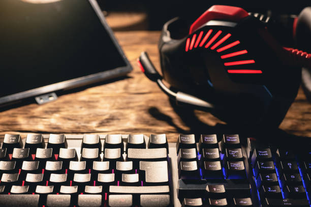 istock Computer screen, keyboard and headphones on the table close up. 1252767665