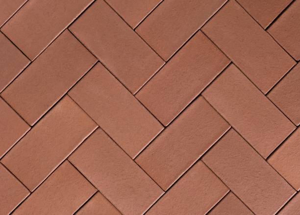 textura de placas de pavimentação herringbone perfeitas em vermelho tijolo - brick wall paving stone brick wall - fotografias e filmes do acervo