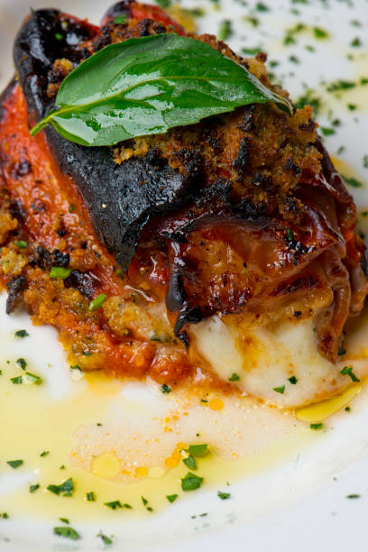 Italian Roasted red bell pepper. Pepper Stuffed with ground seasoned beef, garlic, onions, mozzarella and topped with Parmesan cheese. Classic Italian or green favorite, pepper stuffed and topped with Italian cheeses and topped with olive oil and Basil.